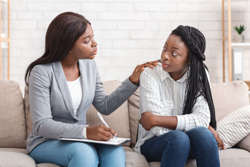 a young women seeking Trauma-Informed Therapy